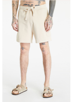 Teplákové béžové kraťasy Tommy Jeans