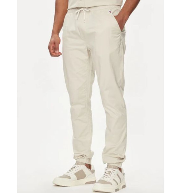 Pánske krémové elastické nohavice Tommy Jeans Pánske krémové elastické nohavice Tommy Jeans