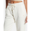Guess dámske joggers all-over logo biele Guess dámske joggers all-over logo biele